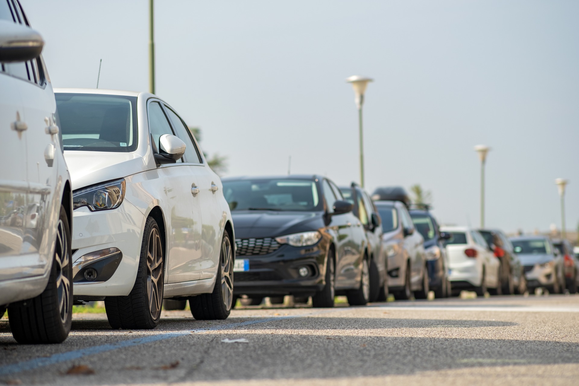 modern-cars-parked-on-city-street-side-in-resident-2022-01-21-23-13-37-utc (1)